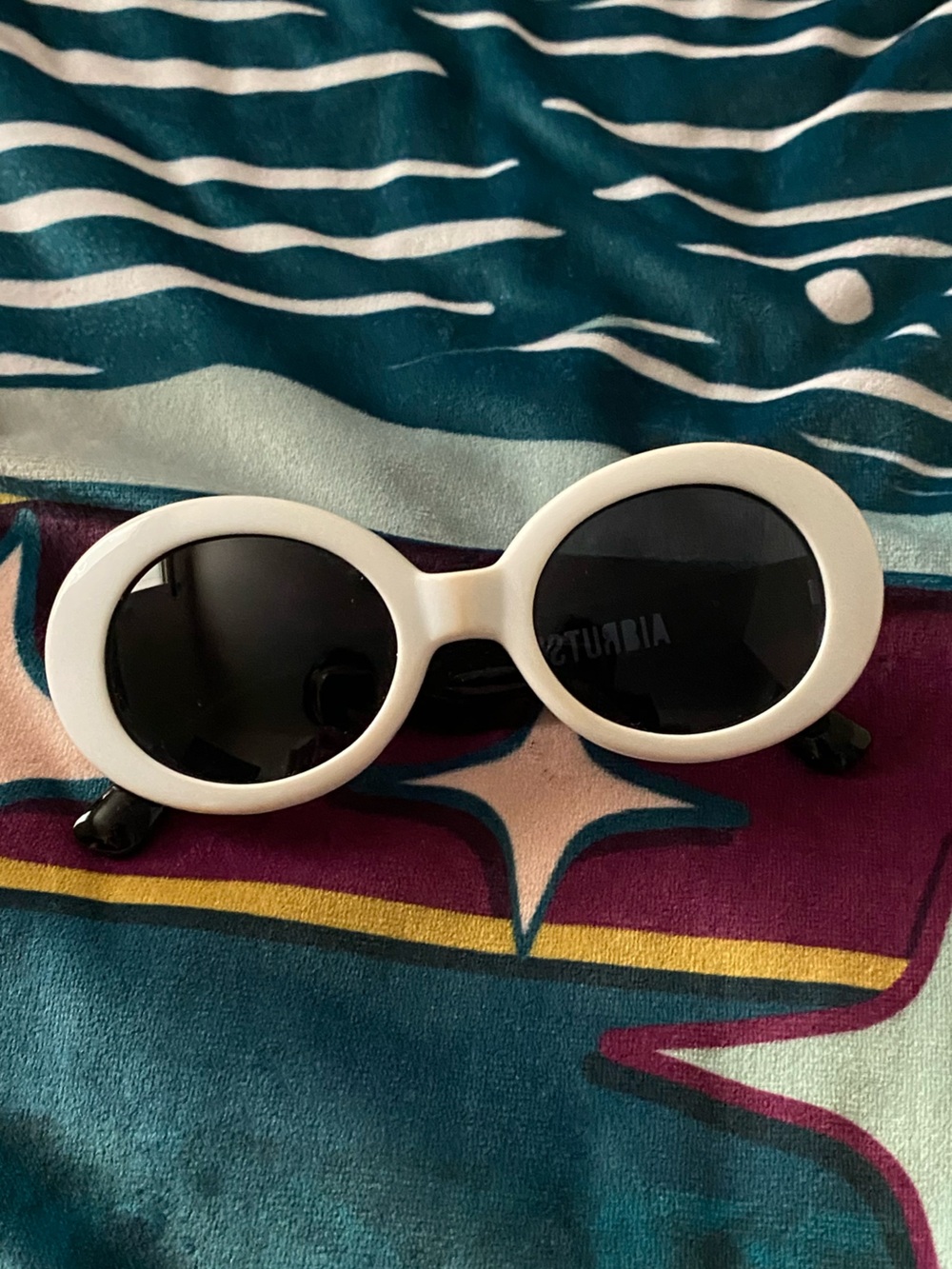 White oval sunglasses